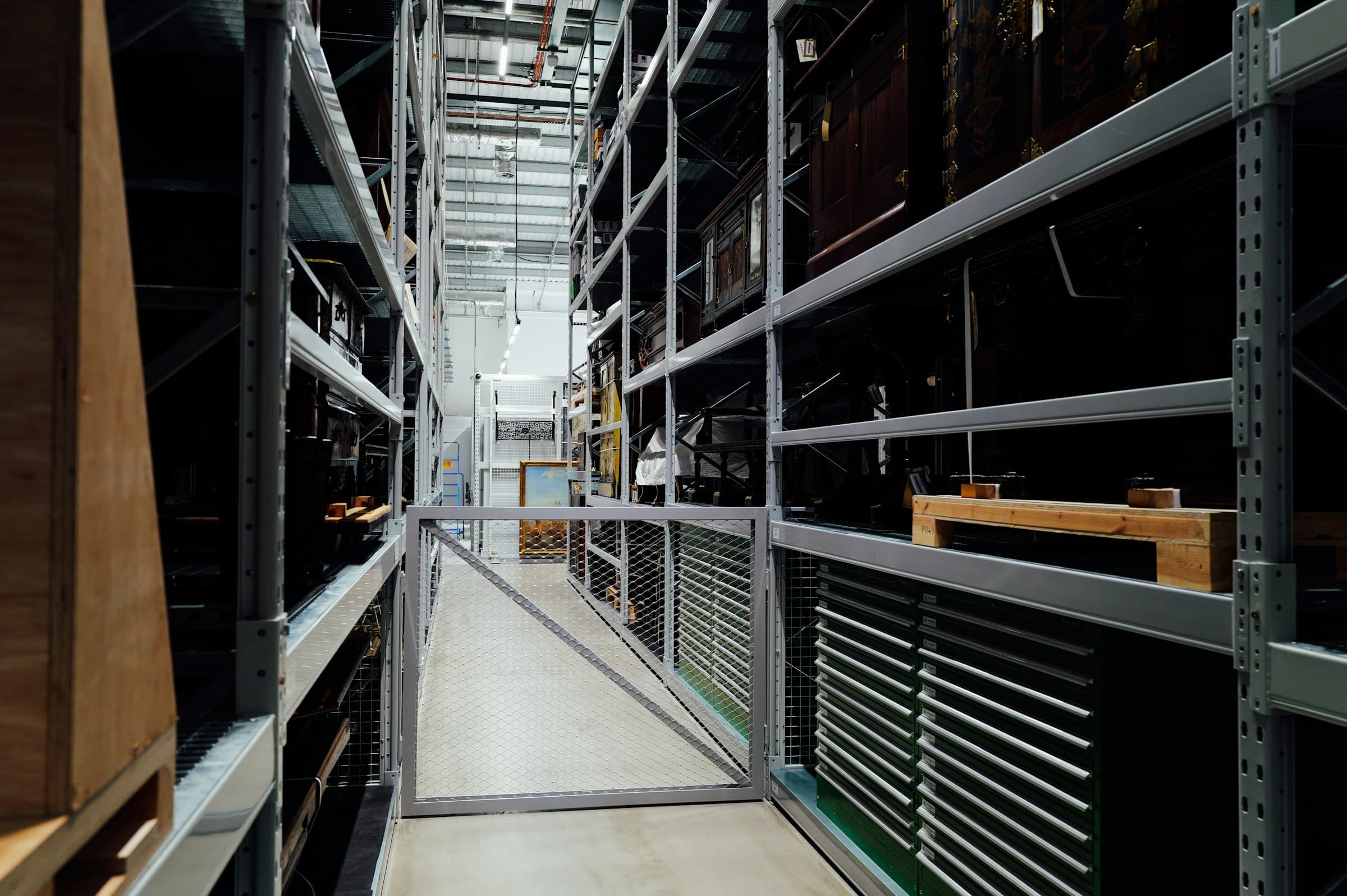 High-bay distribution center with pallet racking and wide inventory aisles.
